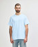 A light blue Gildan Heavy Cotton adult T-shirt displayed on a male model. The shirt has a logo on it.