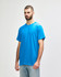 A model wearing a bright blue Gildan Heavy Cotton adult T-shirt, featuring a plain design and a logo on the chest.