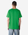 A man wearing a green Gildan Heavy Cotton adult T-shirt, viewed from the back. The shirt has a logo on it.