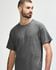 A grey Gildan Heavy Cotton Adult T-Shirt displayed on a model, featuring a simple design and a logo.