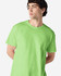A model wearing a bright green Gildan Heavy Cotton adult T-shirt, featuring a simple design and a logo.