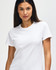 A white Gildan Heavy Cotton Ladies' T-Shirt displayed on a model, featuring a simple design and a logo.
