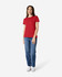 A red Gildan Heavy Cotton Ladies' T-Shirt displayed on a model wearing blue jeans and white sneakers, with a logo present.