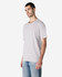 A light grey Gildan Softstyle adult T-shirt displayed on a model, featuring a relaxed fit and no visible logo.