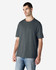 A grey Gildan Softstyle adult T-shirt displayed on a model, featuring a simple design and a relaxed fit.