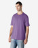 A purple Gildan Softstyle adult T-shirt displayed on a male model, featuring a relaxed fit and basic design.