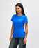 A blue Gildan Softstyle Ladies' T-Shirt displayed on a model, featuring a simple design and short sleeves.