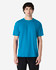 A model wearing a bright blue Gildan Softstyle adult midweight t-shirt, featuring a simple design and a logo.