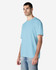 A midweight adult T-shirt in a light blue colour, featuring a round neck and short sleeves, with a logo.
