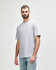A grey adult midweight T-shirt displayed on a model, featuring a simple design and a logo.