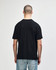 A black Gildan Softstyle adult midweight T-shirt displayed from the back, featuring a simple design and a logo.