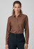 A brown long sleeve button-up shirt for women, featuring a structured fit and a logo on the fabric.