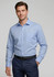 A light blue button-up shirt with long sleeves, featuring a single chest pocket and a collar, worn by a model.