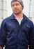 Navy lightweight cotton drill overall worn by a man, featuring a pocket and a logo on the chest.