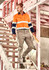 Men's essential basic stretch cargo pants in beige, featured with a logo, paired with an orange and navy work shirt.