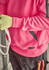 A unisex water-resistant hoodie in bright pink with black accents, worn by a person holding rope and wearing gloves.