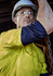 A rugged long sleeve shirt in yellow and navy, featuring reflective elements and a logo, worn by a person in safety gear.