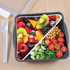 A food container featuring a variety of colorful fruits and vegetables, including berries, kiwi, and cherry tomatoes, with a fork.