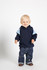 A toddler in a navy hoodie with light blue contrast panels, paired with denim jeans and brown shoes.