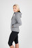 A grey bonded polar fleece hoodie featuring a hood and side pockets, modelled by a woman in black leggings.