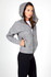 A grey women's hoodie featuring a zip front, large hood, and pockets, modelled by a woman.