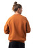 An adults' cotton care sweatshirt in a warm orange colour, featuring a simple design and a logo on the front.