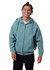 A light blue men's cotton zip-up hoodie featuring a kangaroo pocket and a hood. The model is smiling while wearing it.