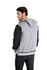 A men's varsity jacket in grey and black with a hood, featuring a logo on the back.
