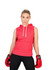 A sleeveless red hoodie with a front pocket and a hood, modelled by a person wearing boxing gloves.