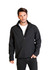 A man wearing a black soft shell jacket with a zippered front and stand-up collar. The jacket has pockets.