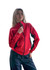 A woman wearing a bright red jacket with black accents, featuring a zippered front and a logo.