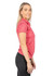 A woman wearing a pink, 100% polyester polo shirt, featuring a logo and set against a white background.