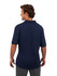 A man in a navy blue cotton pique knit polo shirt viewed from the back, featuring a logo.