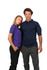 A male model wearing a navy polo shirt and a female model in a purple polo shirt, both standing side by side.