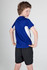 A child models a blue and white Kids Accelerator Cool-Dry T-shirt, showcasing the back design. The shirt has a logo.