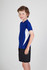 A blue Kids Accelerator Cool-Dry T-shirt with white accents, modelled by a smiling child in black shorts.