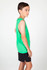 A green tank top is worn by a boy, featuring a sleeveless design and paired with black shorts.