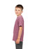 A kid's stone wash T-shirt in mauve, displayed on a child from the side, featuring a simple design and a logo.