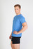 A blue heather T-shirt displayed on a model, paired with black shorts, featuring a logo on the front.