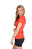 A side view of a woman wearing an orange marl V-neck T-shirt with black shorts. The shirt has a subtle texture and a logo.