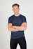 A navy crew neck T-shirt, made from marl fabric, displayed on a male model with casual black pants.