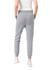 Grey women's track pants with a slim fit and pockets, paired with a fitted white top and shoes.