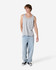 A unisex fine jersey tank in grey, paired with loose-fitting light blue jeans and black shoes. Features a logo.