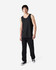 A black Gildan Heavy Cotton adult tank top worn by a model, paired with black trousers and sneakers.