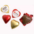 A selection of chocolate hearts in red, gold, and brown foil, featuring various shapes and wrapping.
