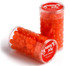A transparent tube containing orange jelly beans, labelled with a logo and topped with a red lid.