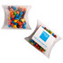 A pillow pack containing M&Ms in various colours, including red, blue, yellow, green, brown, and orange.