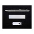 A silver pen, USB drive, and a sleek metallic note holder arranged on a black background.