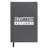 A recycled leather notebook featuring a dark cover with the text "SWIFTTAX RETURNS" printed prominently on the front.