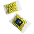 A transparent bag contains greenish-yellow wasabi peas, showcasing a mix of sizes and shapes. The bag features a logo.